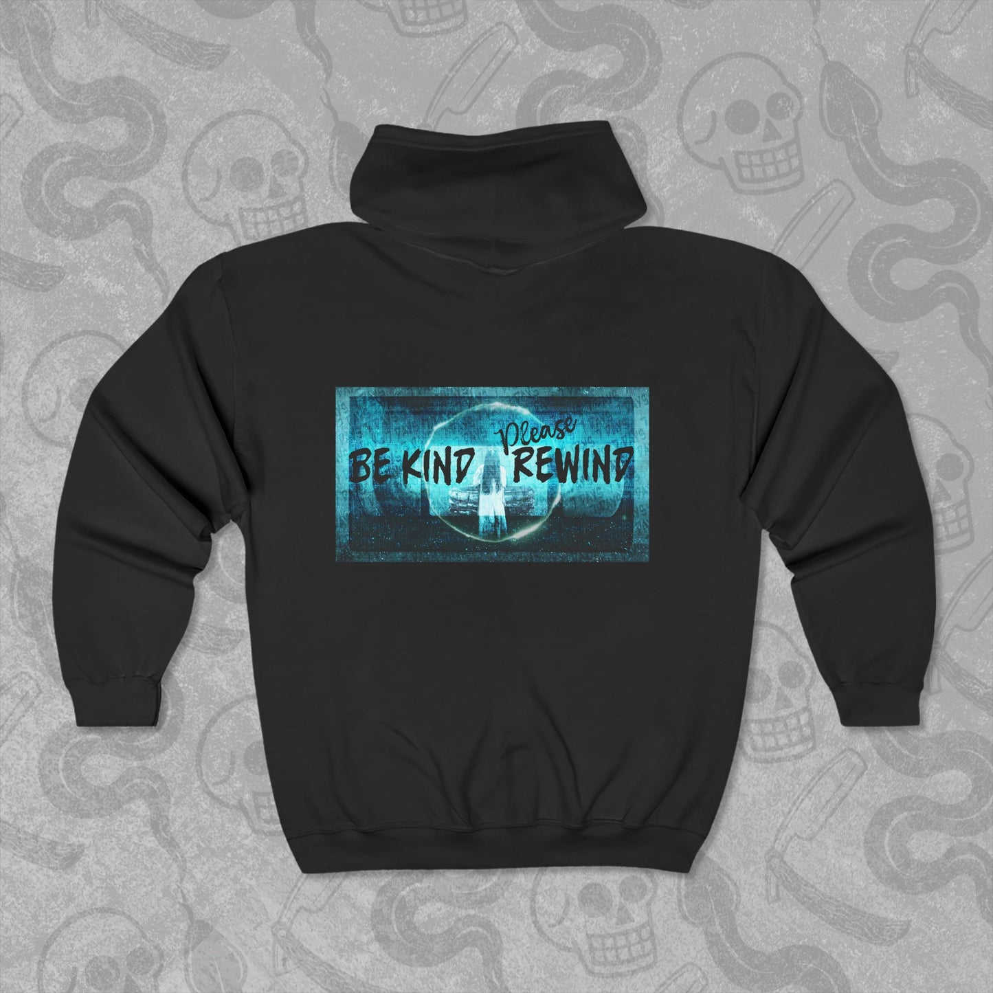 Be Kind Please Rewind design printed on the back of a black zippered hoodie with vibrant colors.