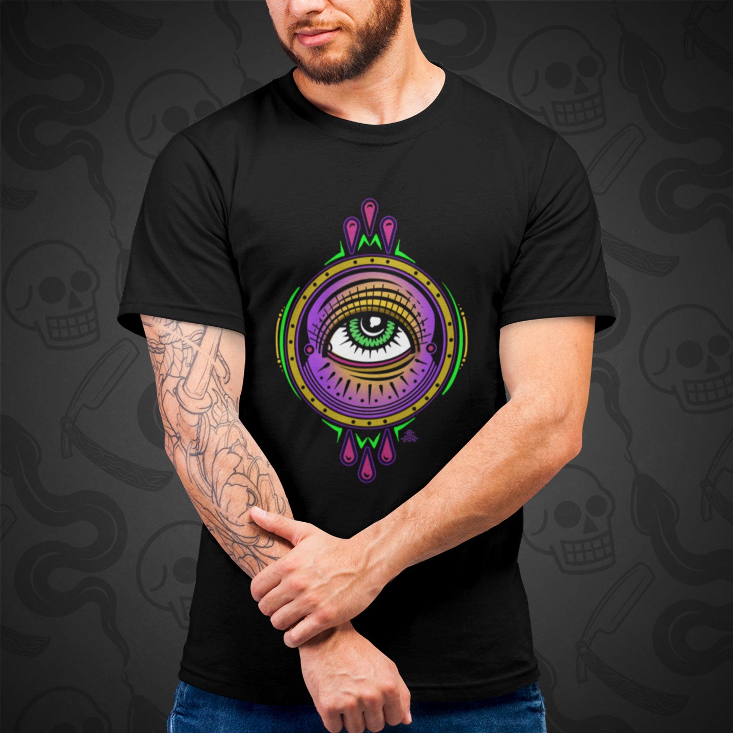 Cropped image of a model wearing black t-shirt with the All Seeing Eye design printed on the front with vibrant colors.