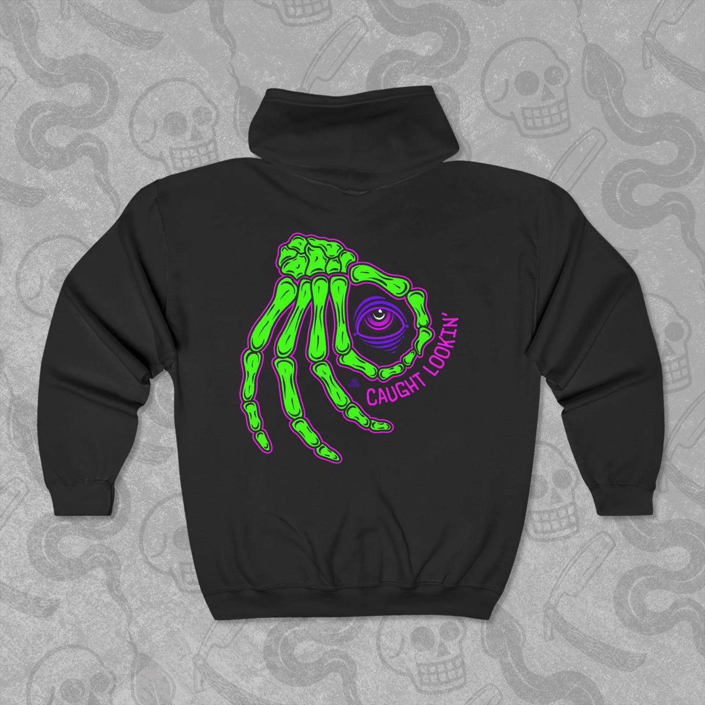 Caught Lookin' design printed on the back of a black zippered hoodie with vibrant colors.