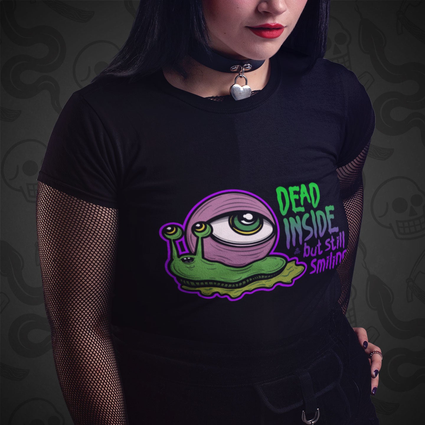 Cropped image of a model wearing black t-shirt with the Dead Inside But Sill Smiling design printed on the front with vibrant colors.