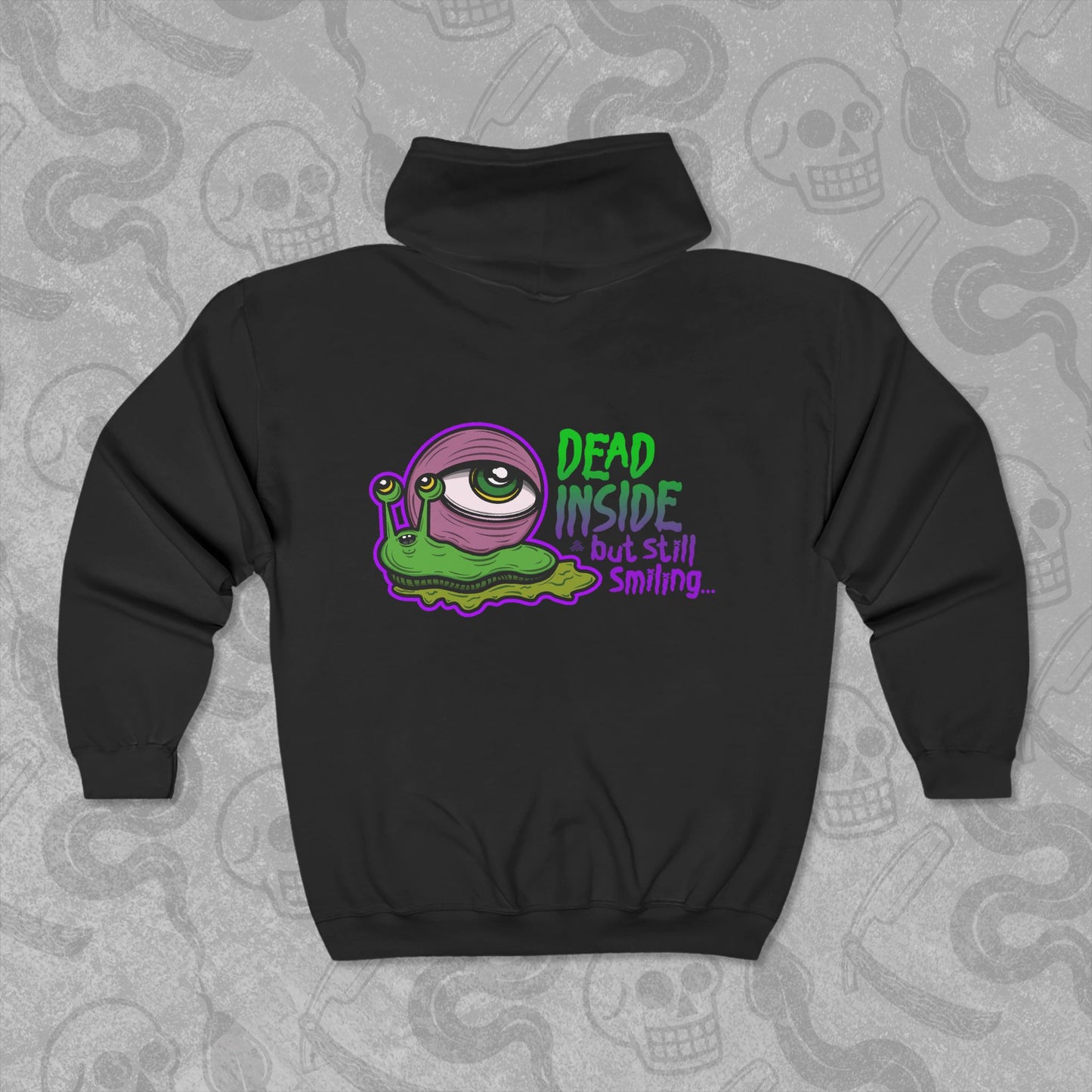 Dead Inside But Still Smiling design printed on the back of a black zippered hoodie with vibrant colors.