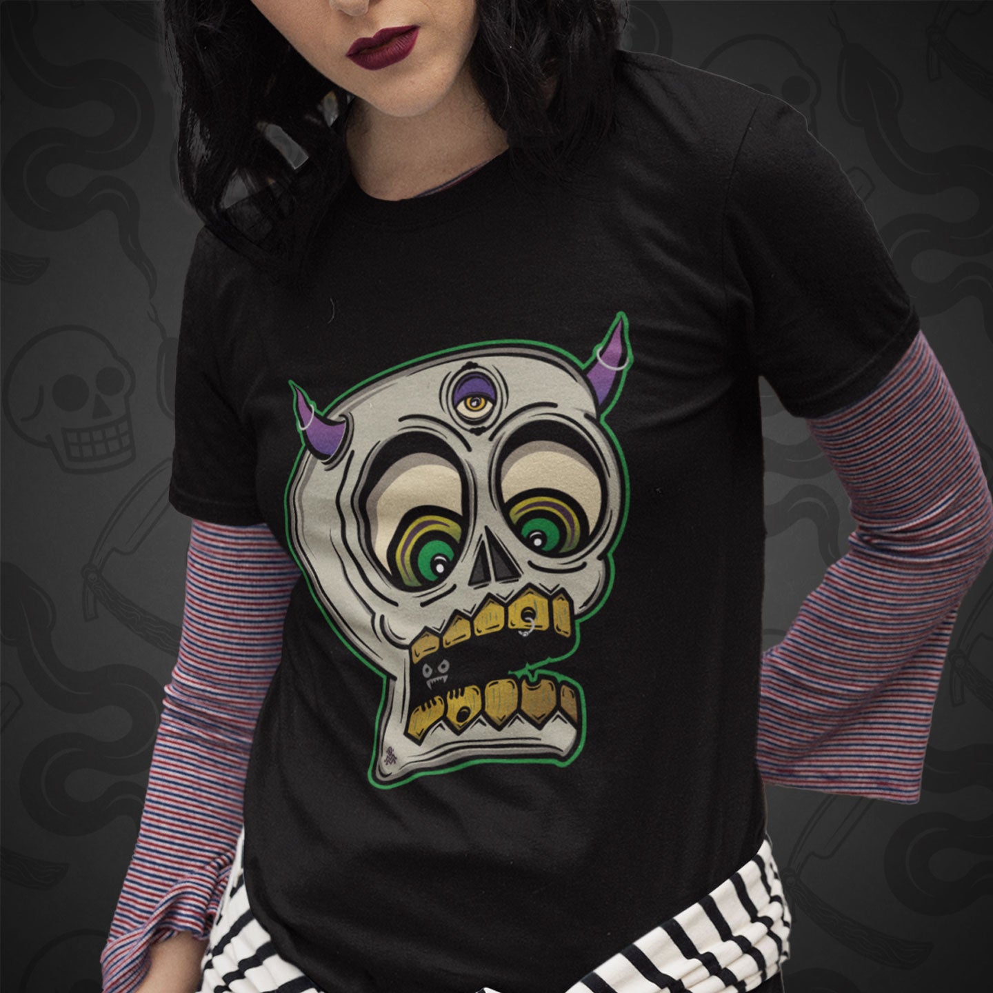 Cropped image of a model wearing black t-shirt with the Demon Skull design printed on the front with vibrant colors.