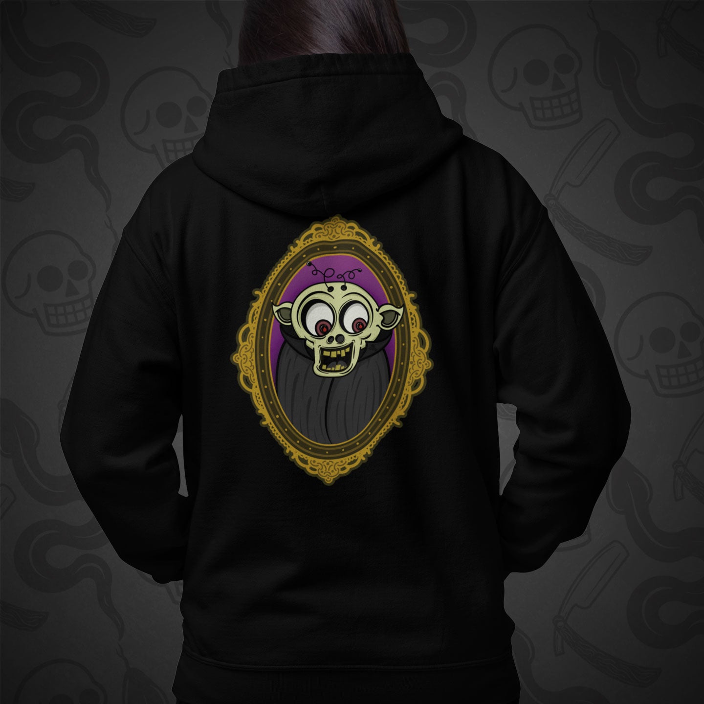 Cropped image of a Model wearing a black zippered hoodie with The Ghoul design printed on the back with vibrant colors.