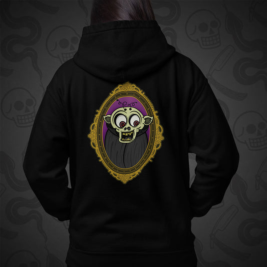 Cropped image of a Model wearing a black zippered hoodie with The Ghoul design printed on the back with vibrant colors.