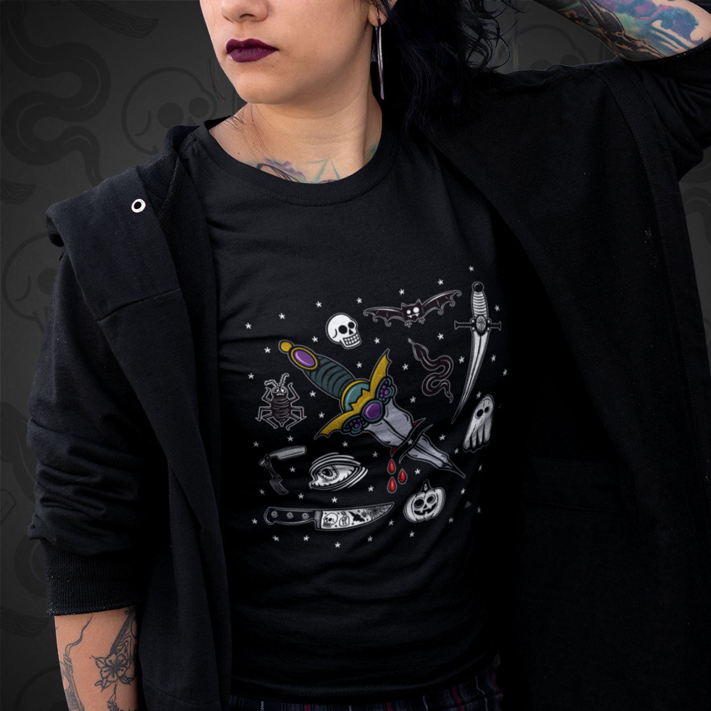 Cropped image of a model wearing black t-shirt with The Ritual design printed on the front with vibrant colors.